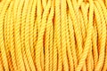 Close up detail of nautical industrial marine yellow coil rope