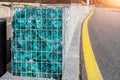 Close-up detail of new modern beautiful gabion fence with metal cage filled by crushed stone and shattered artificial Royalty Free Stock Photo