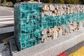 Close-up detail of new modern beautiful gabion fence with metal cage filled by crushed stone and shattered artificial Royalty Free Stock Photo