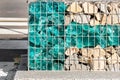 Close-up detail of new modern beautiful gabion fence with metal cage filled by crushed stone and shattered artificial Royalty Free Stock Photo