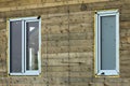 Close-up detail of new narrow plastic vinyl windows installed in