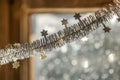 Close-up detail new year Christmas decoration, silver stars and rain on window light blurred bokeh background. Sparkling DIY Royalty Free Stock Photo