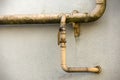 Close-up detail of old dirty painted yellow natural gas pipes wi Royalty Free Stock Photo