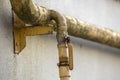 Close-up detail of old dirty painted yellow natural gas pipes wi Royalty Free Stock Photo