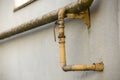 Close-up detail of old dirty painted yellow natural gas pipes wi Royalty Free Stock Photo