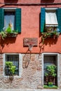 Close up detail with old medieval architecture venetian window. Open wooden shutters Royalty Free Stock Photo