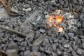 Close-up detail old medieval blacksmith furnace with hot burning coal flame forge iron metal. Craft smith farrier Royalty Free Stock Photo