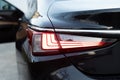 Close up detail on one of the LED red taillight modern luxury car. Car back lights shining. Exterior detail automobile Royalty Free Stock Photo