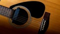 Detail of orange acoustic guitar Royalty Free Stock Photo