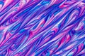 An abstract textured background of pink and blue metallic glitter paint swirls Royalty Free Stock Photo