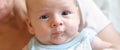 Close-up detail portrait of cute little peaceful newborn baby boy child face with beautiful open eyes Royalty Free Stock Photo