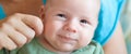 Close-up detail portrait of cute little peaceful smiling baby boy face Royalty Free Stock Photo