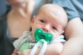 Close-up detail portrait of mother holding cute little peaceful newborn baby in her hands Royalty Free Stock Photo