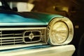 Close-up detail of retro car. Selective focus on the car`s headlight Royalty Free Stock Photo