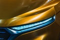 Close up detail shot of headlight of modern luxury sports car. Front view of supercar. Motor sport background concept Royalty Free Stock Photo