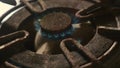 Close up detail shot of old rusty kitchen stove ring burning after switched on fire with lighter flame in dangerous gas energy and Royalty Free Stock Photo