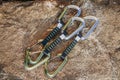 Close up detail shot of a quickdraw, two rock climbing carabiners with a sling or webbing. Royalty Free Stock Photo