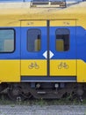 Close up detail of the Sliding Doors and associated Safety Markings on old urban Dutch Railway Passenger Compartments.