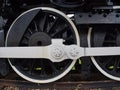 Close up detail of a steam locomotive drive wheels