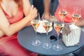 Close-up detail table with many filled glasses of white champagne prosecco at party celebration event outdoors. People having fun Royalty Free Stock Photo