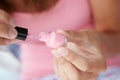 Close up detail teenage girl painting nails