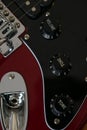 Close-up detail of the tone and volume knobs of an electric guitar Royalty Free Stock Photo