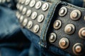 close up detail of an unbuckled leather belt on a faded pair of blue jeans Royalty Free Stock Photo