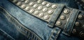 close up detail of an unbuckled leather belt on a faded pair of blue jeans Royalty Free Stock Photo