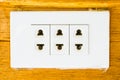 Close up of detail of a very old light switch on old wood texture backgrounds. Royalty Free Stock Photo