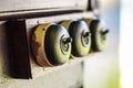 Close up of detail of a very old light switch on old wood texture backgrounds. Royalty Free Stock Photo