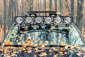 Close-up detail view of custom made roof rack bar with extra headlight mounted on roof of heavy duty pick up suv car Royalty Free Stock Photo
