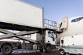 Close-up detail view of highloader cargo catering service truck loading commercial passenger aicraft with food sets and Royalty Free Stock Photo