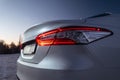 Close up detail view of the LED red taillight of modern white car Royalty Free Stock Photo