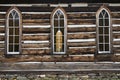 Close up of the detail of weathered wooden log cabin church