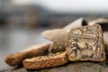 Mudlarking on the River Thames: Close up of a detailed piece of old broken pottery found along a river