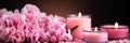 Close-up detailed shot of spa care items and decorations like candles, flowers, and aromatic oils Royalty Free Stock Photo