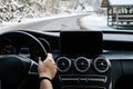 Close up details of driver driving a modern car. Inside of car details, drivers view through windshield