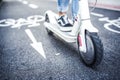 Close up details of electric scooter on the road. Ecological and urban transport in the city. Royalty Free Stock Photo