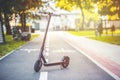 Close up details of electric scooter on the road. Ecological and urban transport in the city. Royalty Free Stock Photo