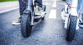 Close up details of electric scooter on the road. Ecological and urban transport in the city. Royalty Free Stock Photo