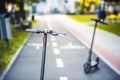 Close up details of electric scooter on the road. Ecological and urban transport in the city. Royalty Free Stock Photo