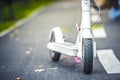 Close up details of electric scooter on the road. Ecological and urban transport in the city. Royalty Free Stock Photo