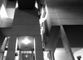 Close up details of the entrance of the roger stevens university building a 1960s concrete geometric building illuminated at night