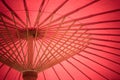 Close up details inside of traditional handmade wooden red umbrella.