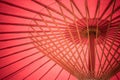 Close up details inside of traditional handmade wooden red umbrella.