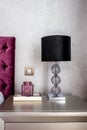 Details of lamp on nightstand in modern stylish bedroom Royalty Free Stock Photo