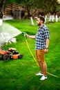 Close up details of manual hose lawn irrigation. Details of irrigation Royalty Free Stock Photo