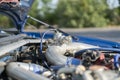 a close up details in the motor engine of a vehicle sport racer car with opened hood