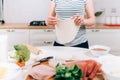 Close up details of pregnant woman preparing pizza and making dough Royalty Free Stock Photo