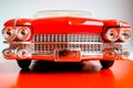 Close up detail of red antique car headlights and hood. Front view of realistic scale car model. American classic Royalty Free Stock Photo